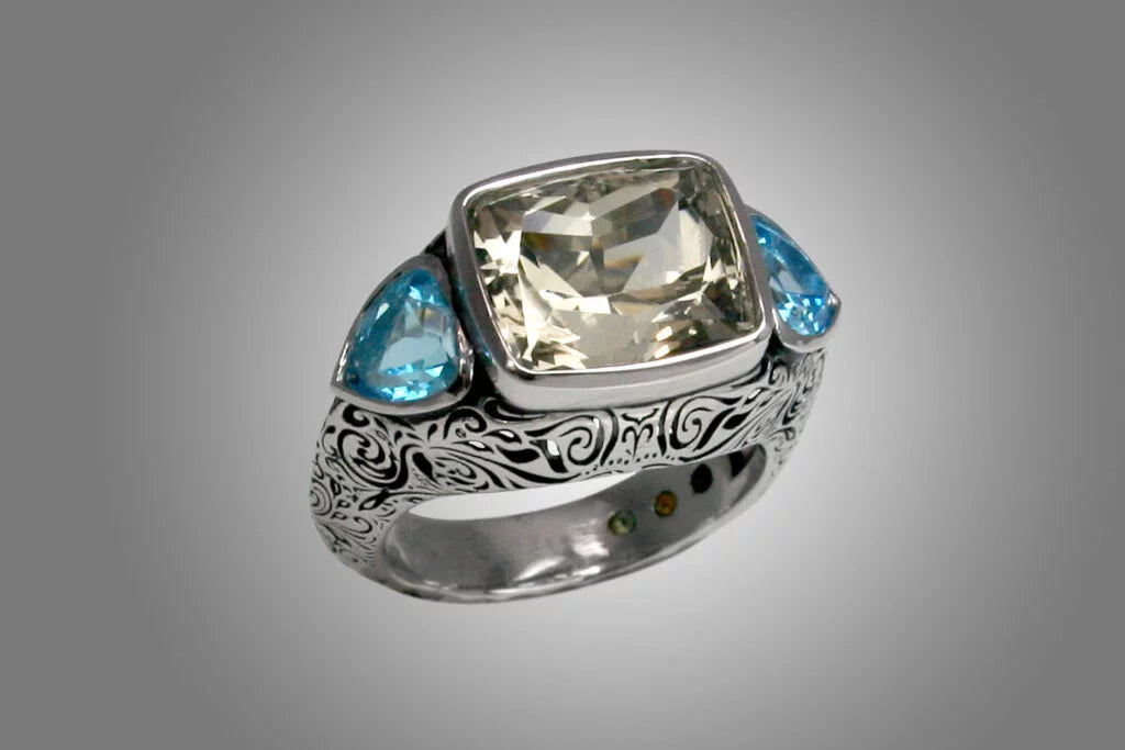custom designed ring with smoky and blue topaz