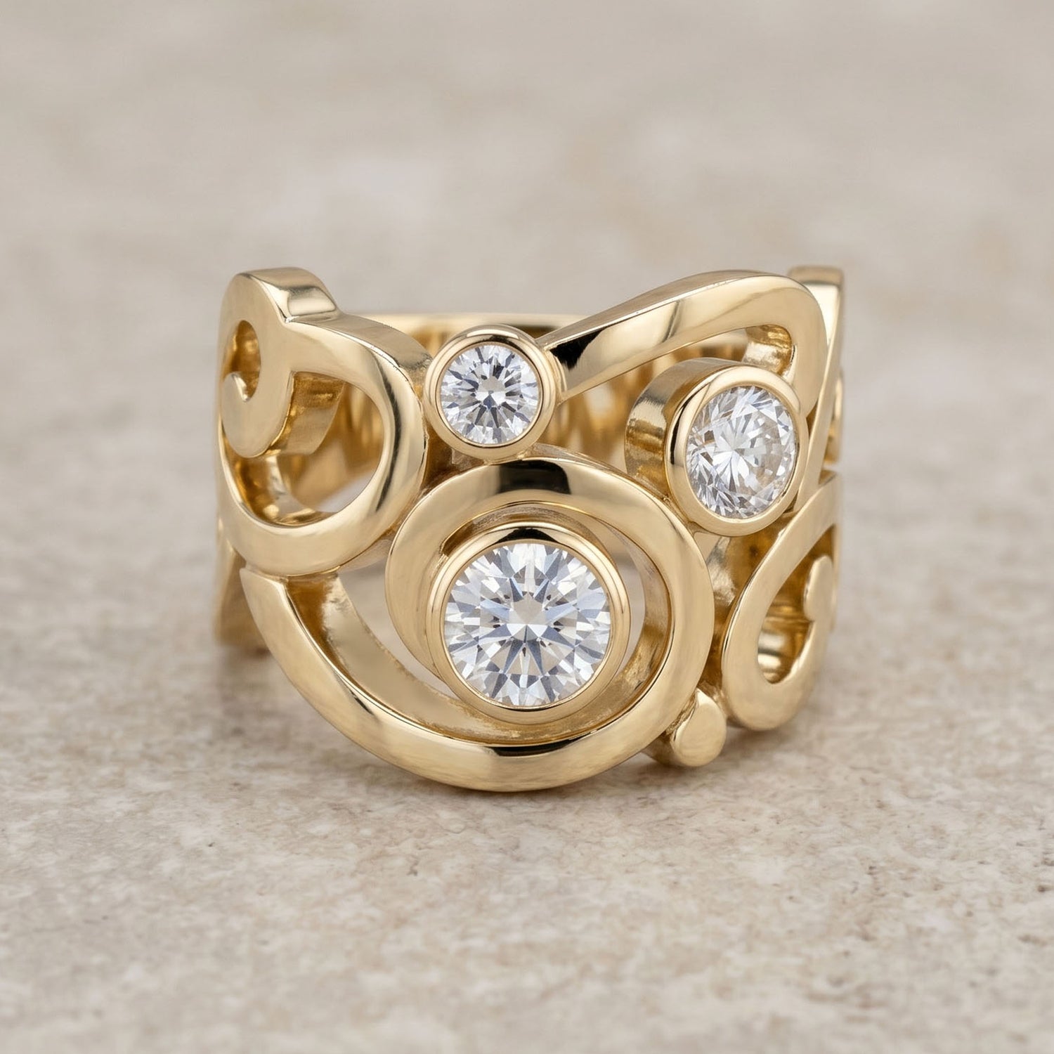 Gold ring with three diamonds on a beige background
