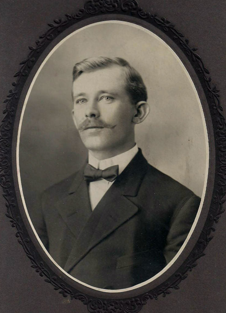 Black and white photo of man with bowtie