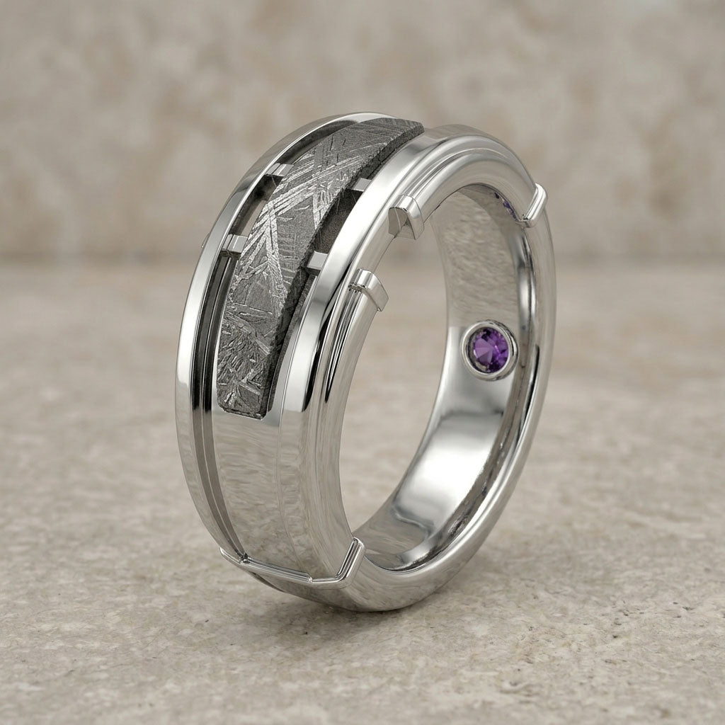 Silver ring with a purple gemstone on a beige background