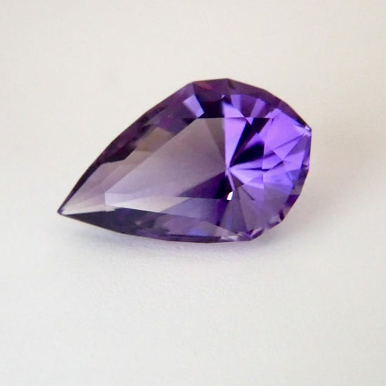 A purple amethyst pear shaped stone